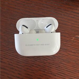 Apple air pods has name and phone number engraved on it